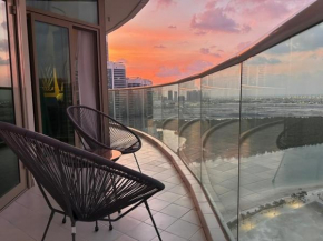 Urban cozy -sea view with pool and gym access
